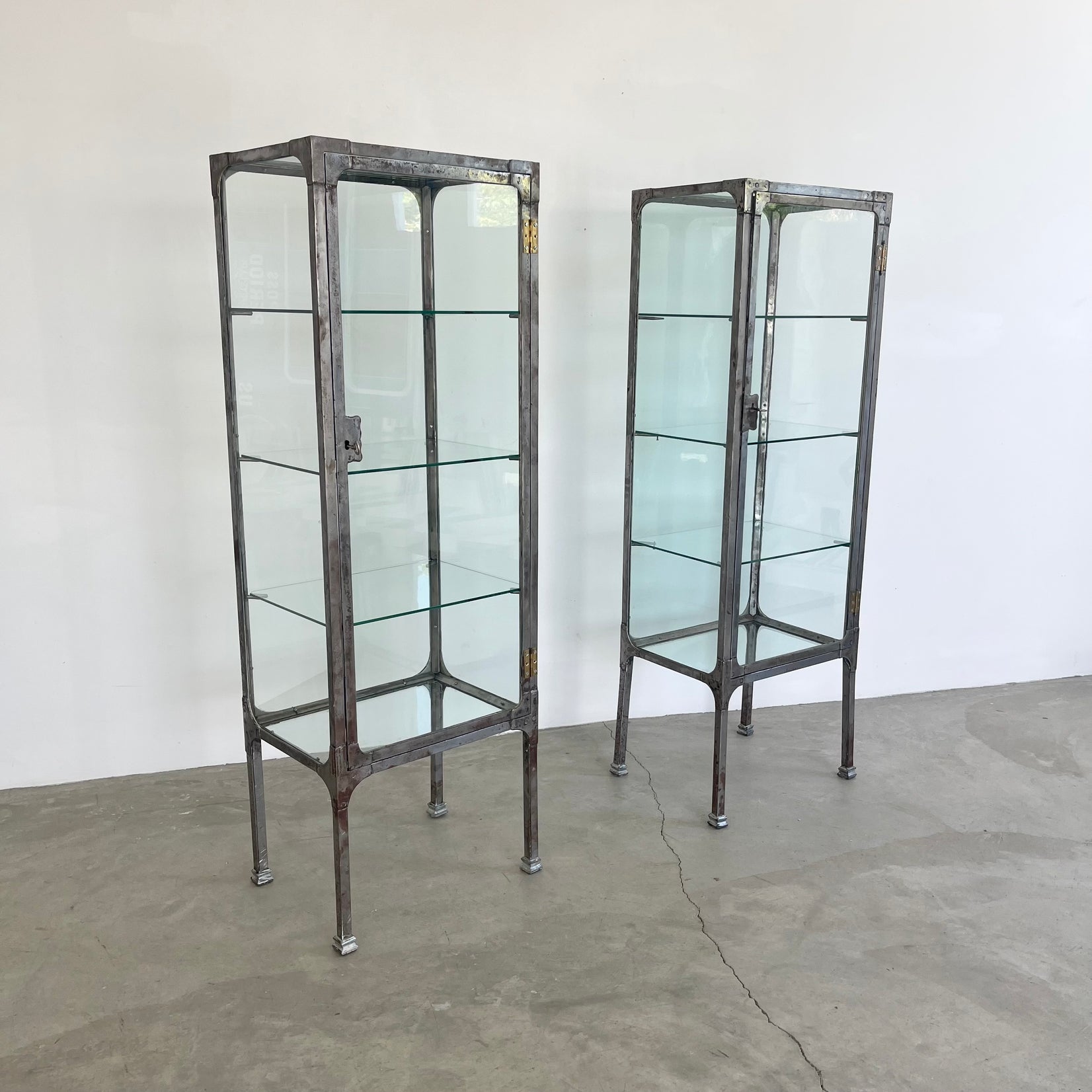 Pair of Matching Steel and Glass Vitrines