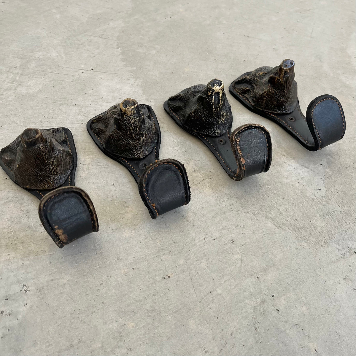 Bronze and Leather Boar Head Wall Hooks
