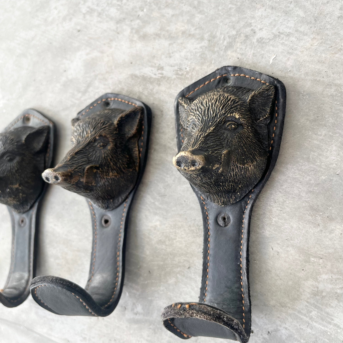 Bronze and Leather Boar Head Wall Hooks