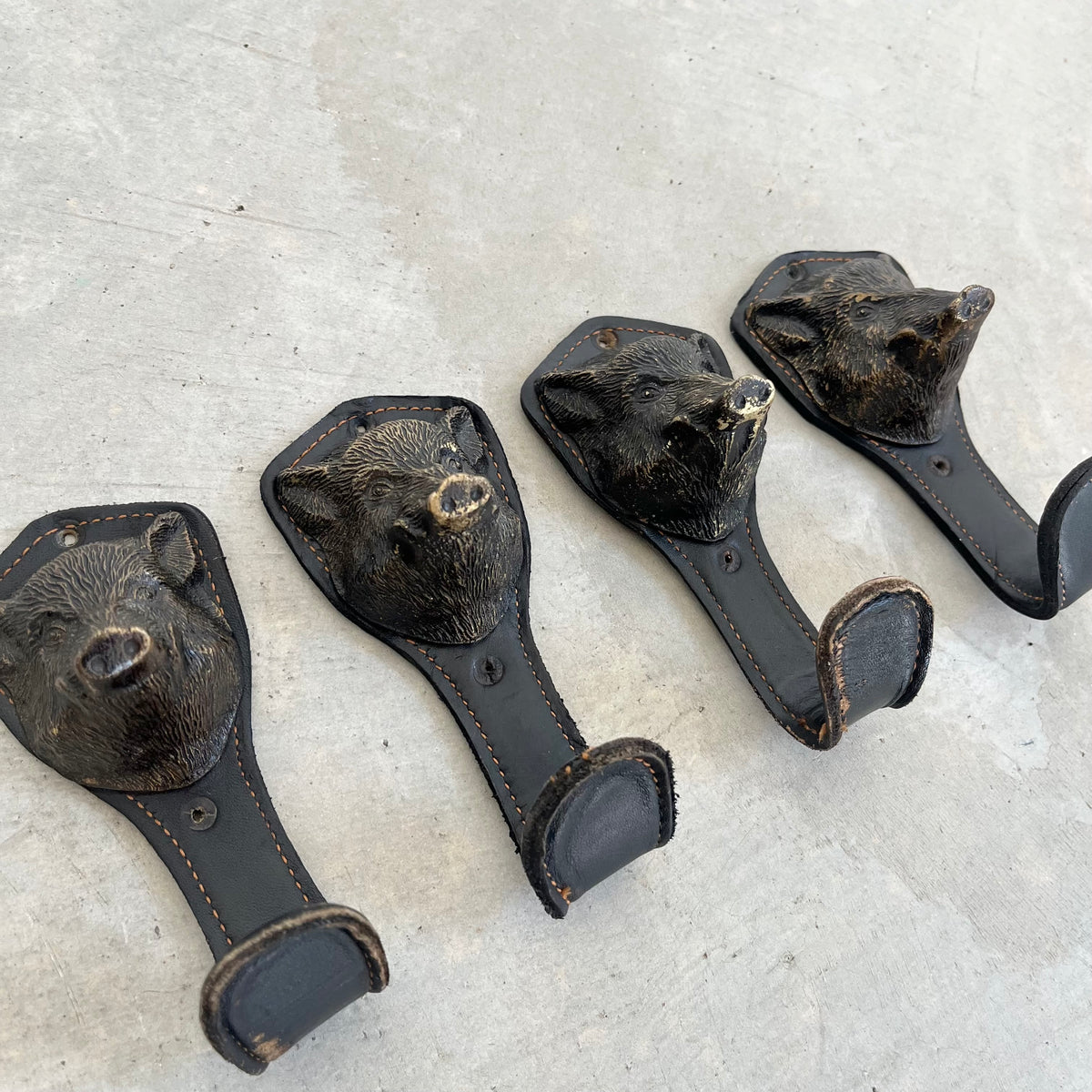 Bronze and Leather Boar Head Wall Hooks