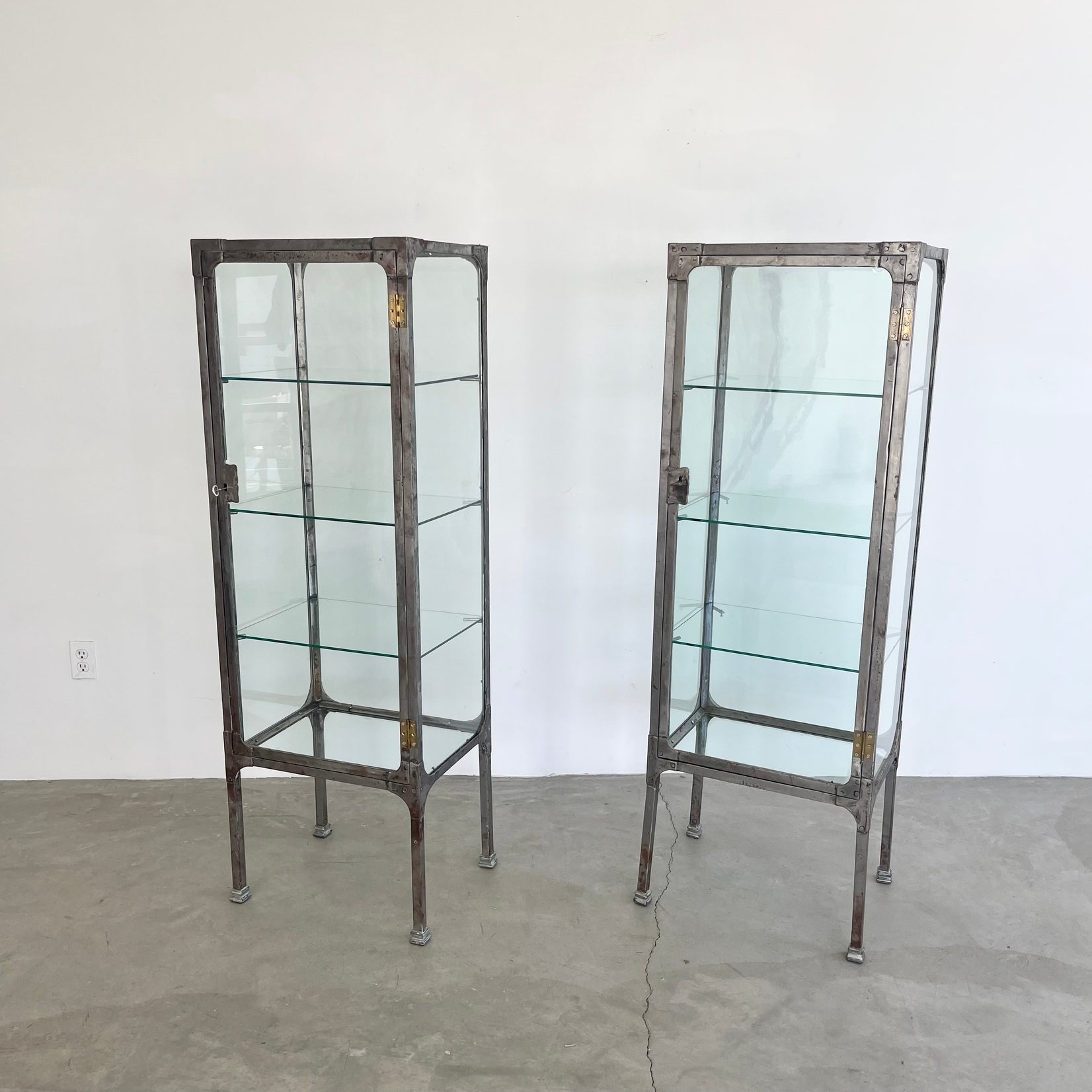 Pair of Matching Steel and Glass Vitrines