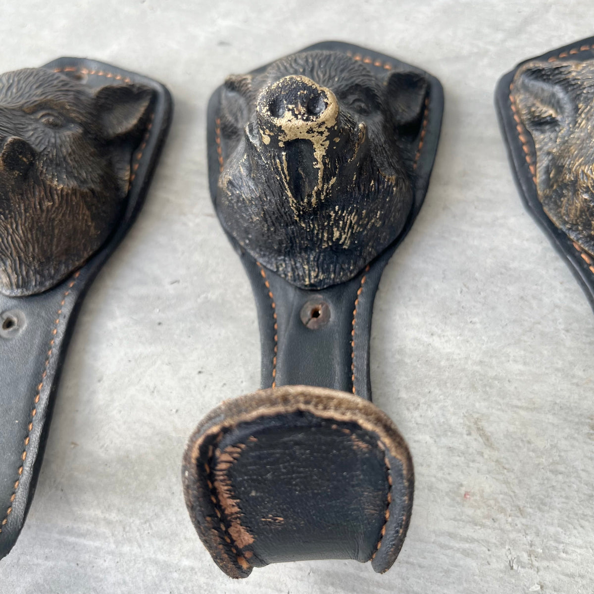 Bronze and Leather Boar Head Wall Hooks