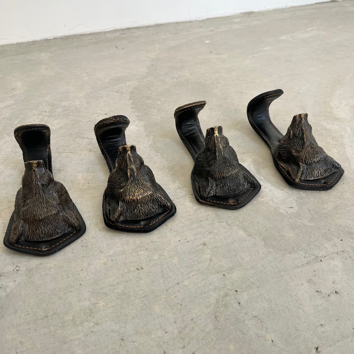 Bronze and Leather Boar Head Wall Hooks