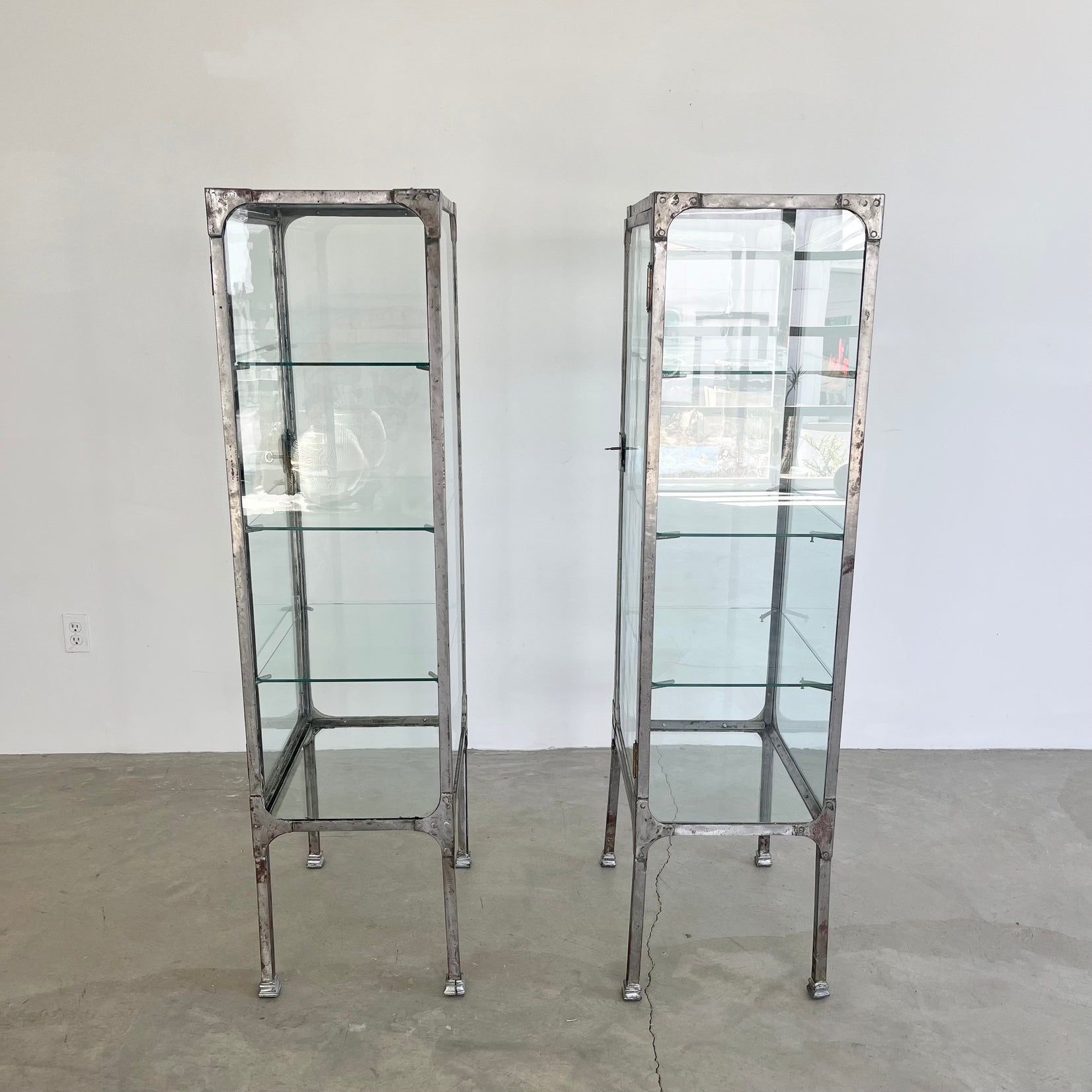 Pair of Matching Steel and Glass Vitrines