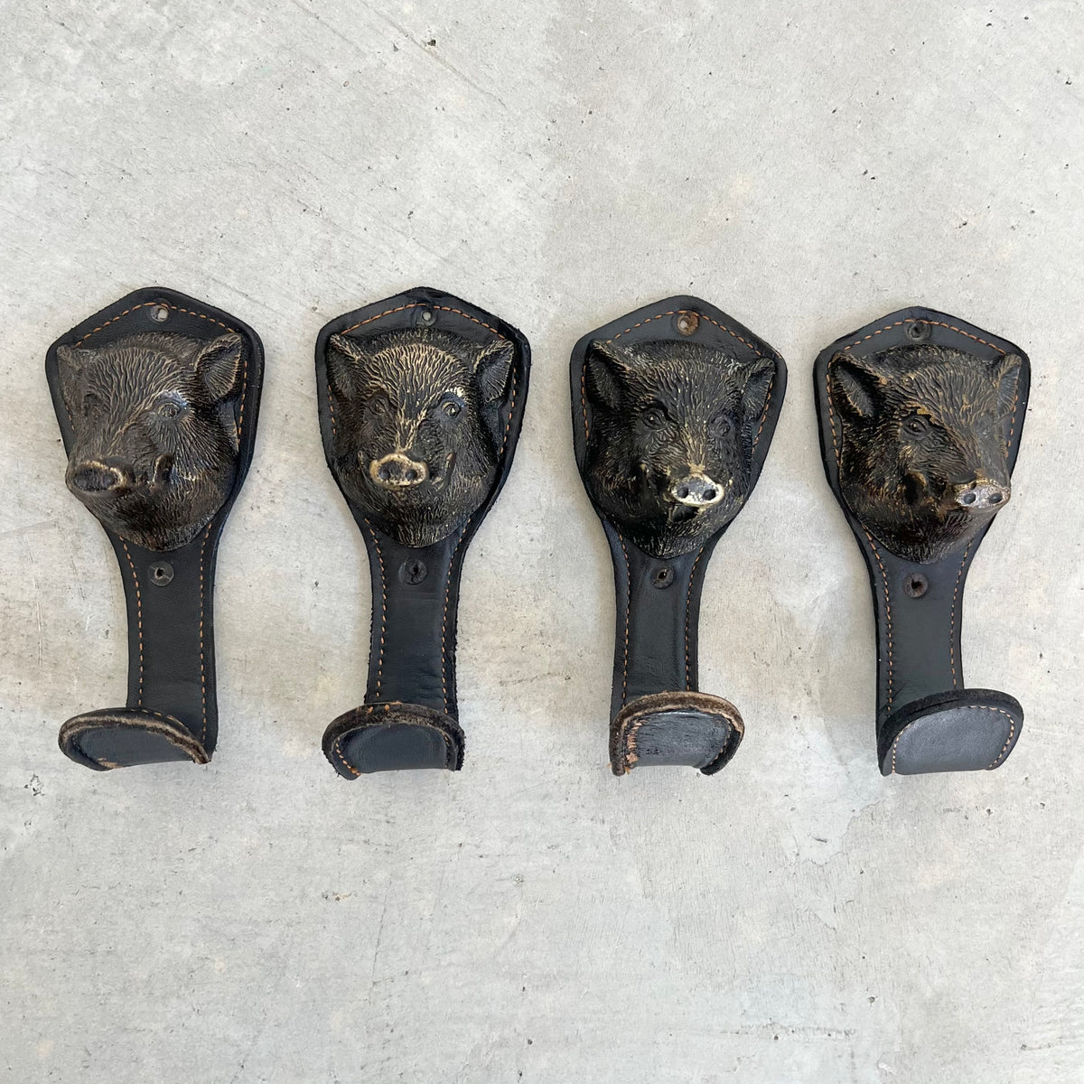 Bronze and Leather Boar Head Wall Hooks