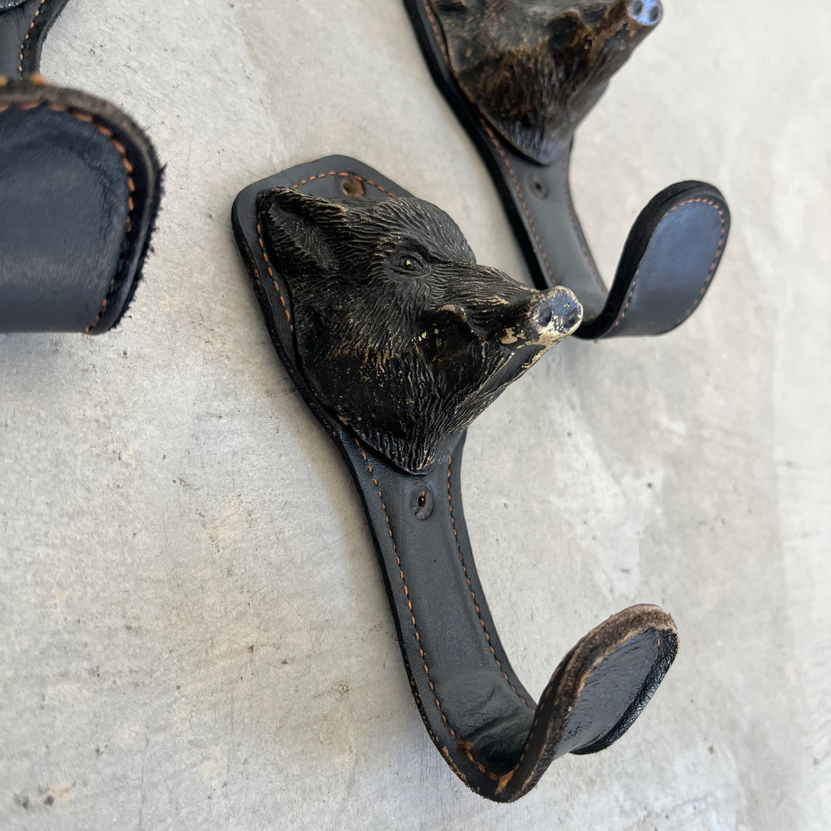 Bronze and Leather Boar Head Wall Hooks