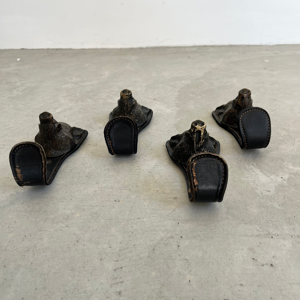 Bronze and Leather Boar Head Wall Hooks