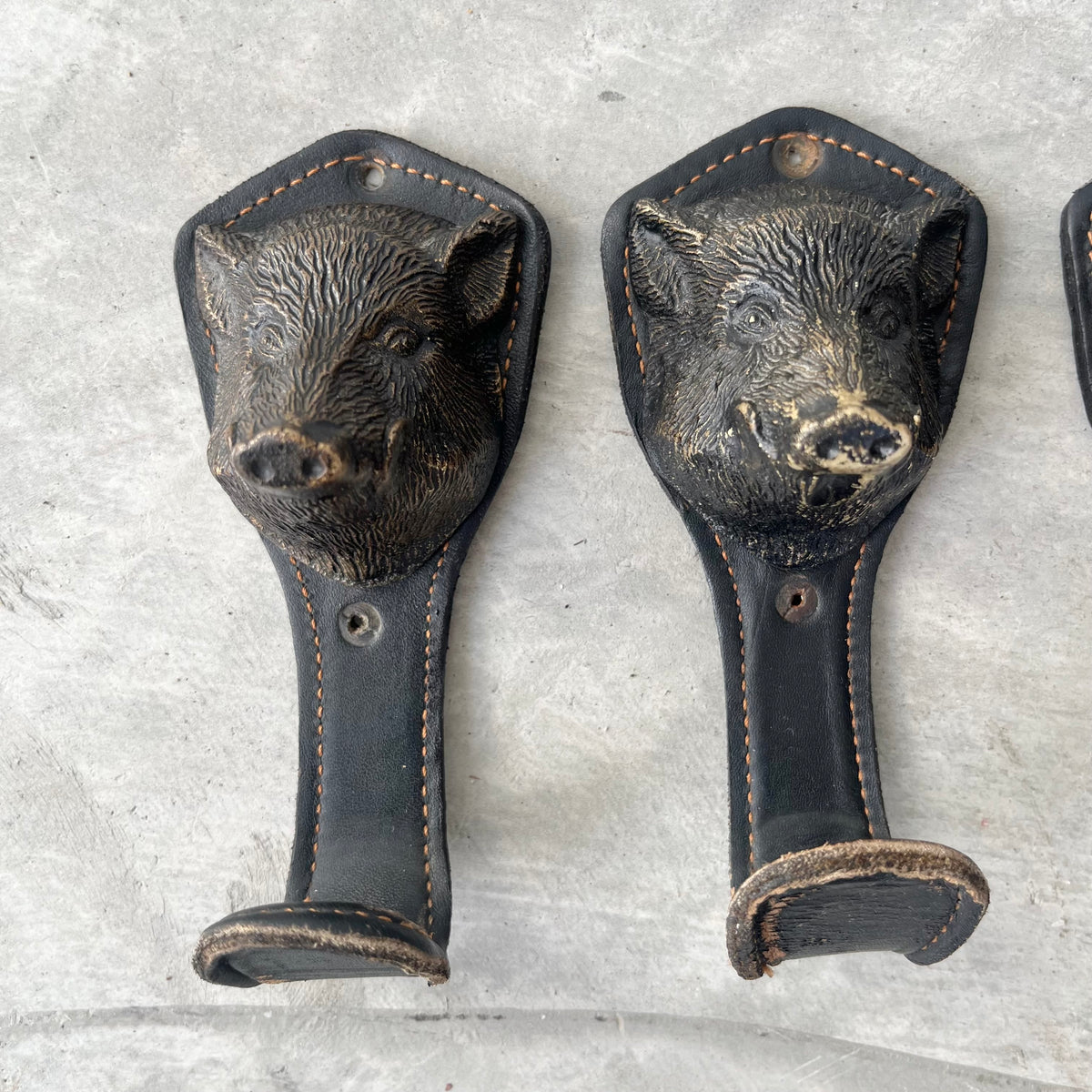 Bronze and Leather Boar Head Wall Hooks