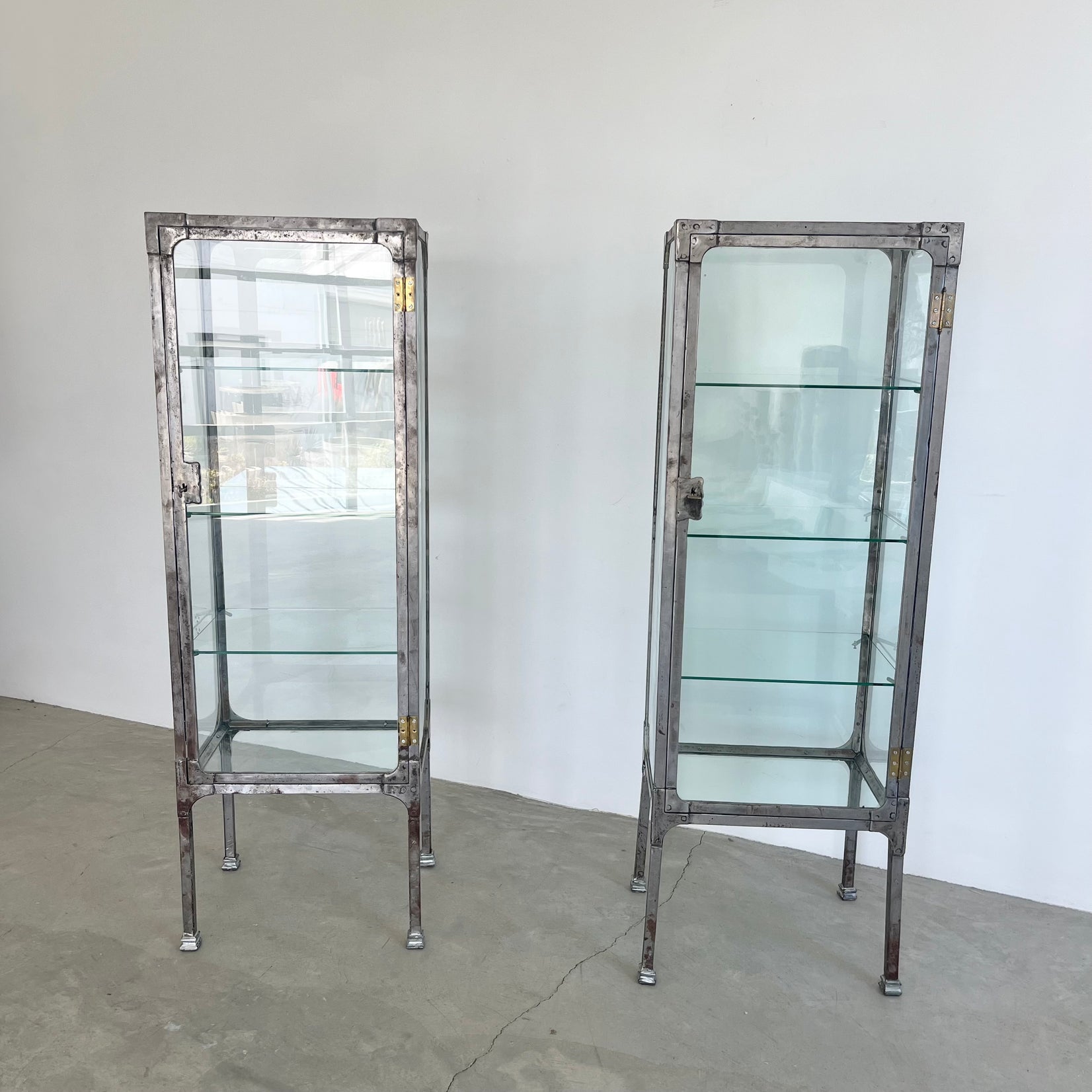 Pair of Matching Steel and Glass Vitrines