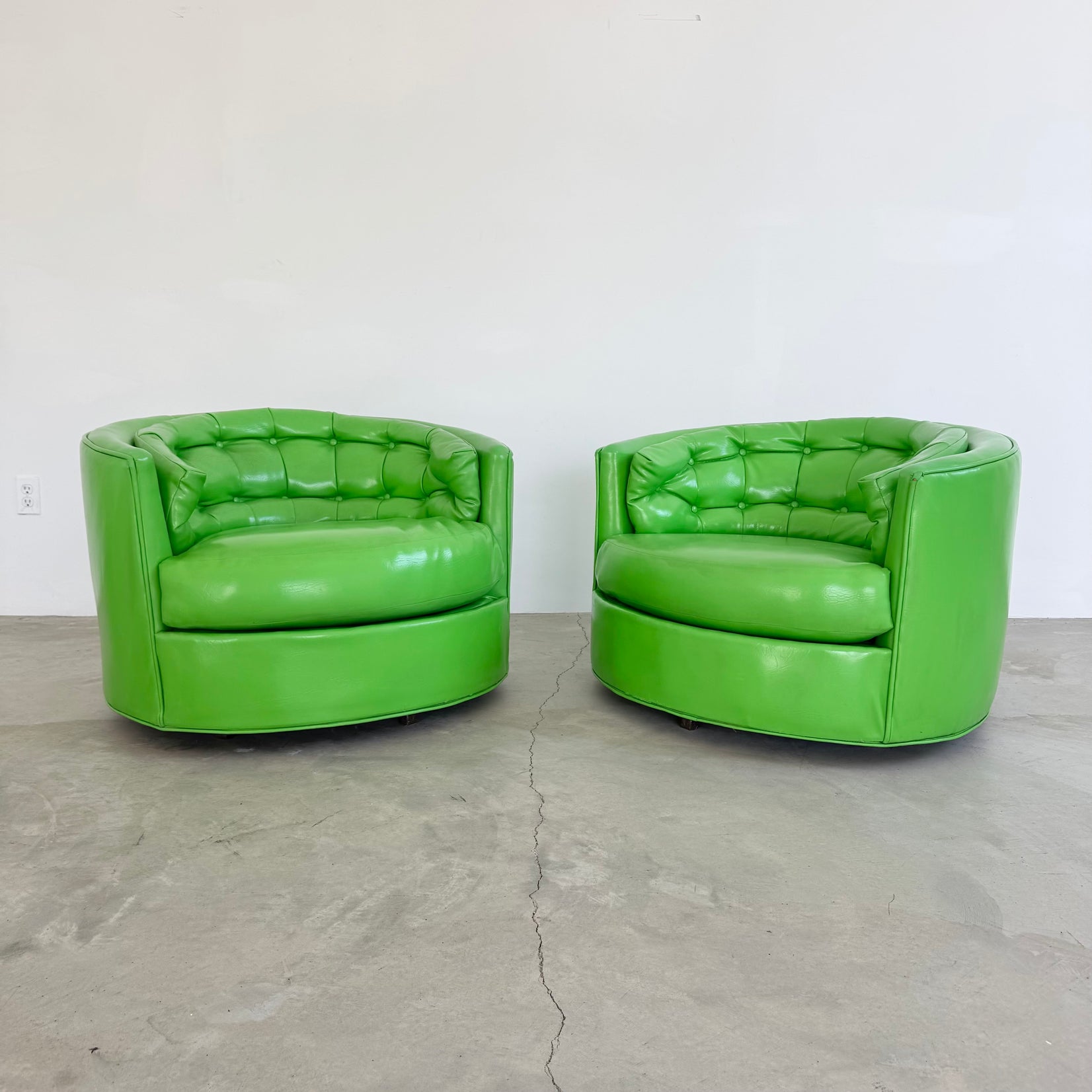 Pair of Green Vinyl Swivel Chairs