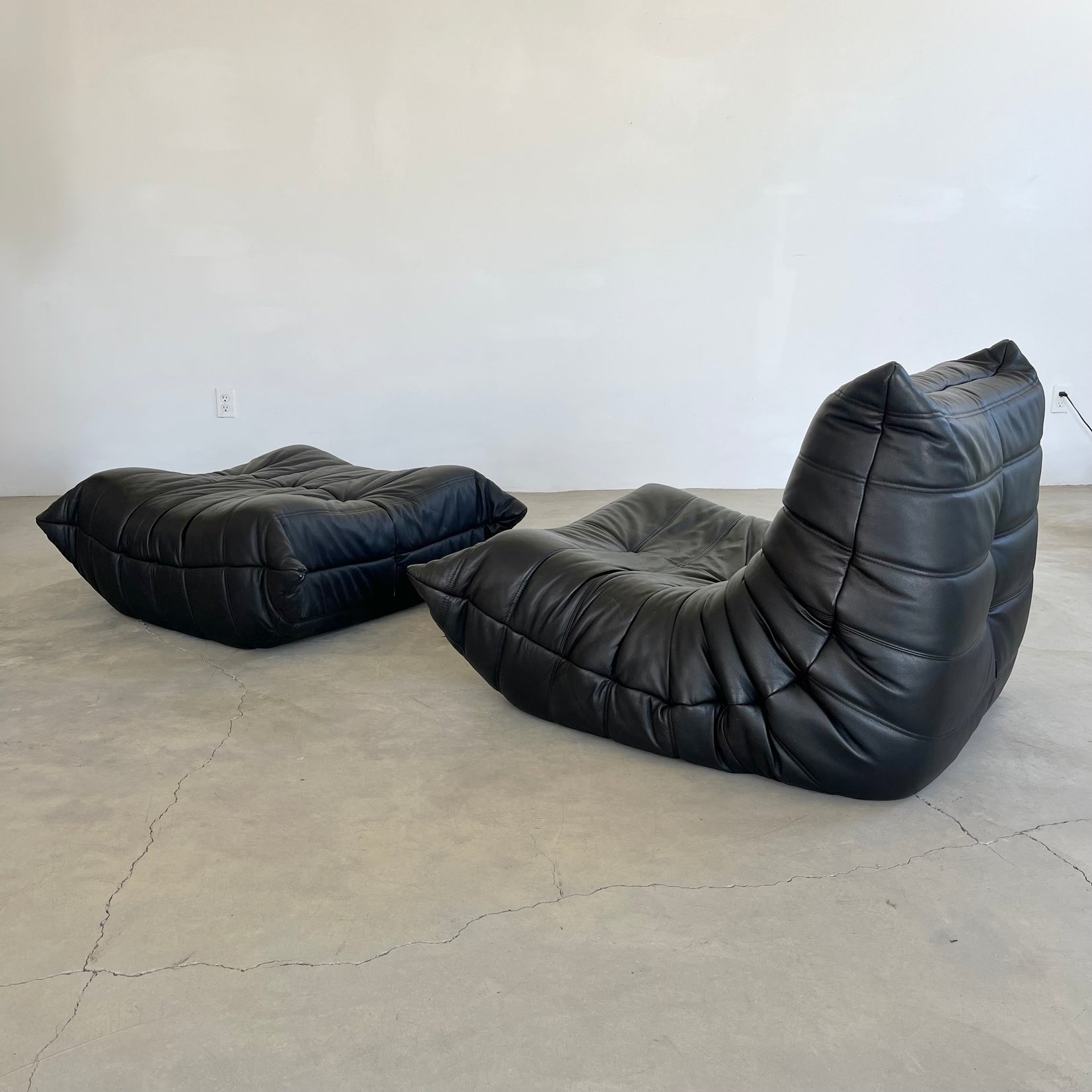 Black leather Fireside Togo Seat & Ottoman