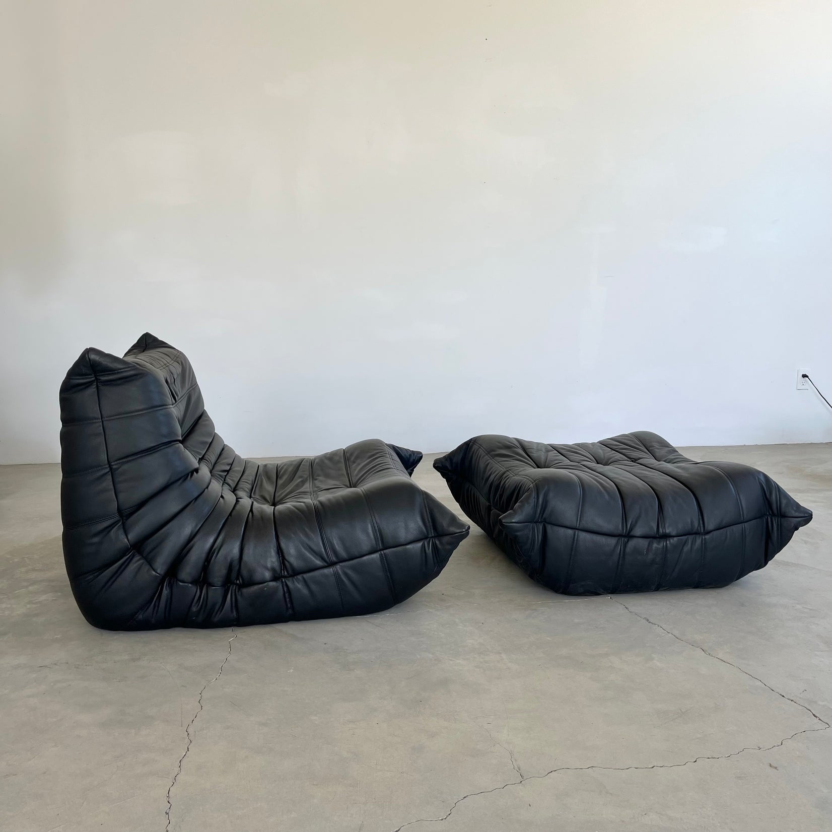 Black leather Fireside Togo Seat & Ottoman