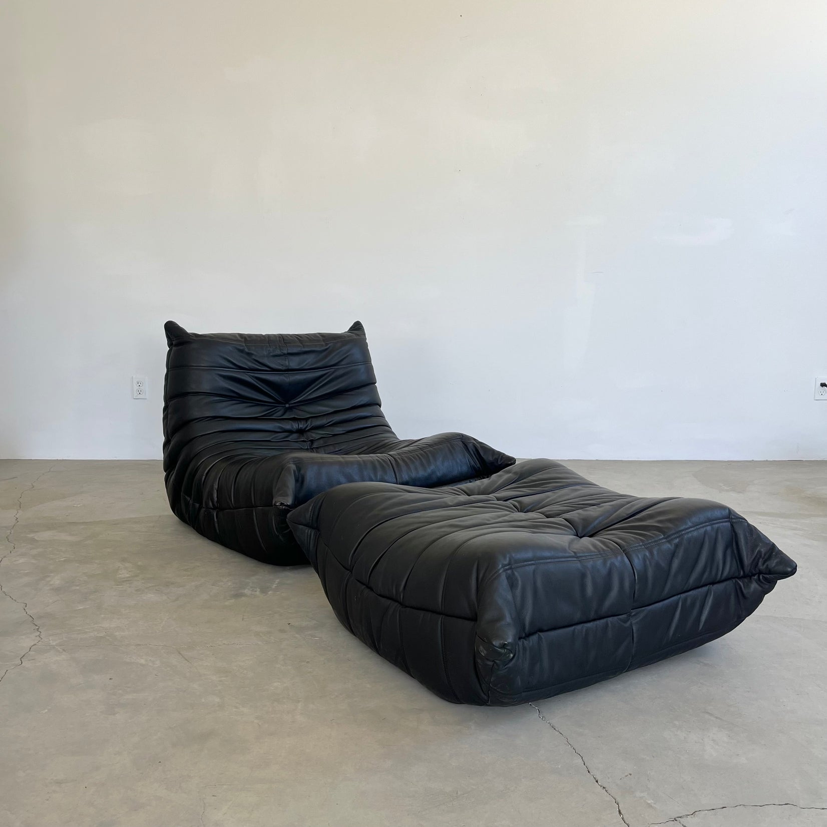 Black leather Fireside Togo Seat & Ottoman
