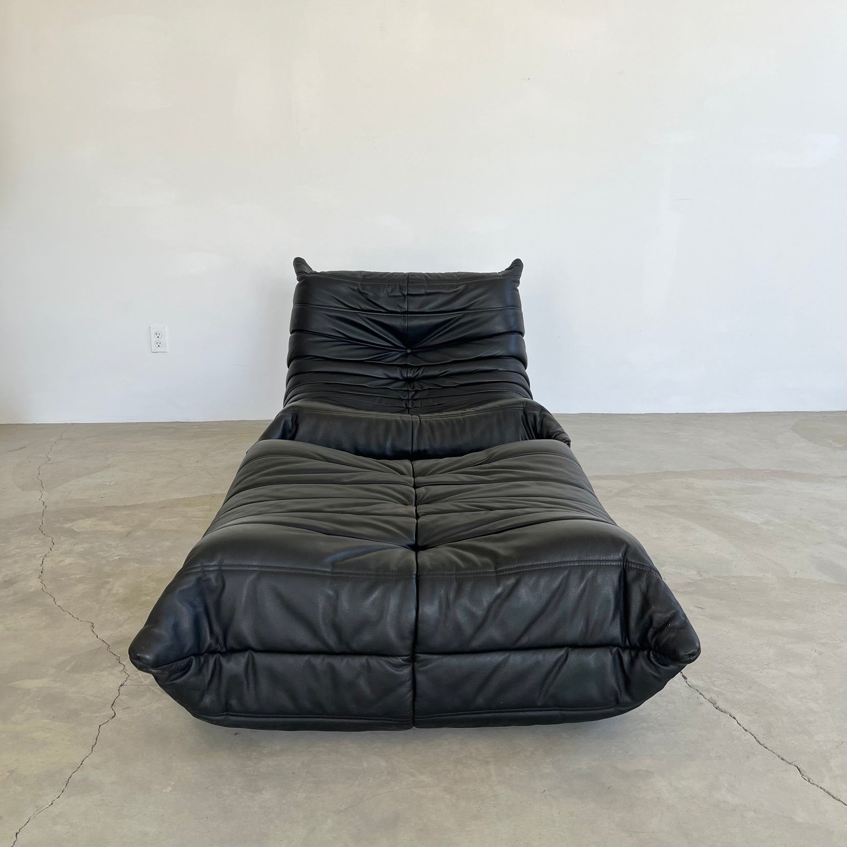 Black leather Fireside Togo Seat & Ottoman