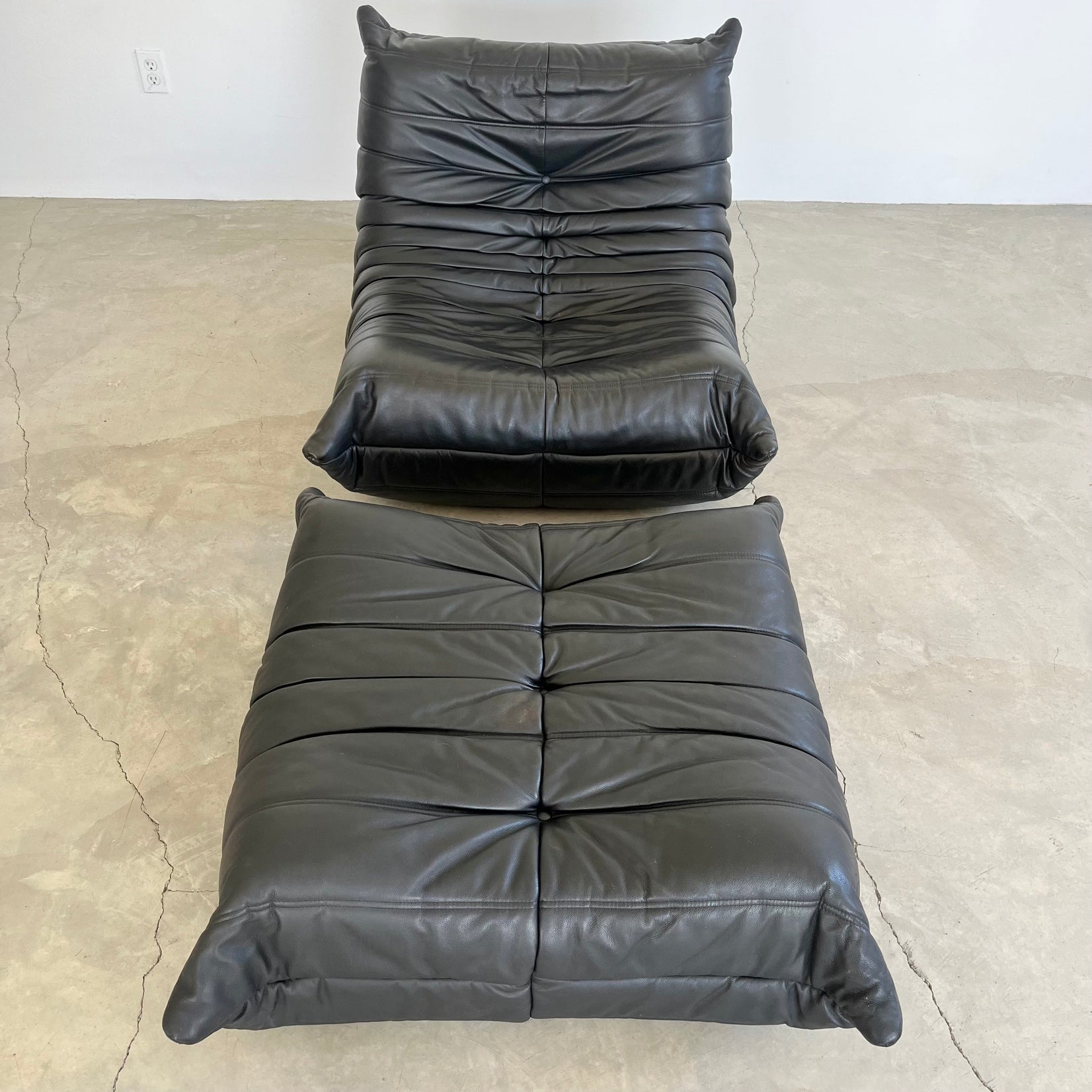 Black leather Fireside Togo Seat & Ottoman