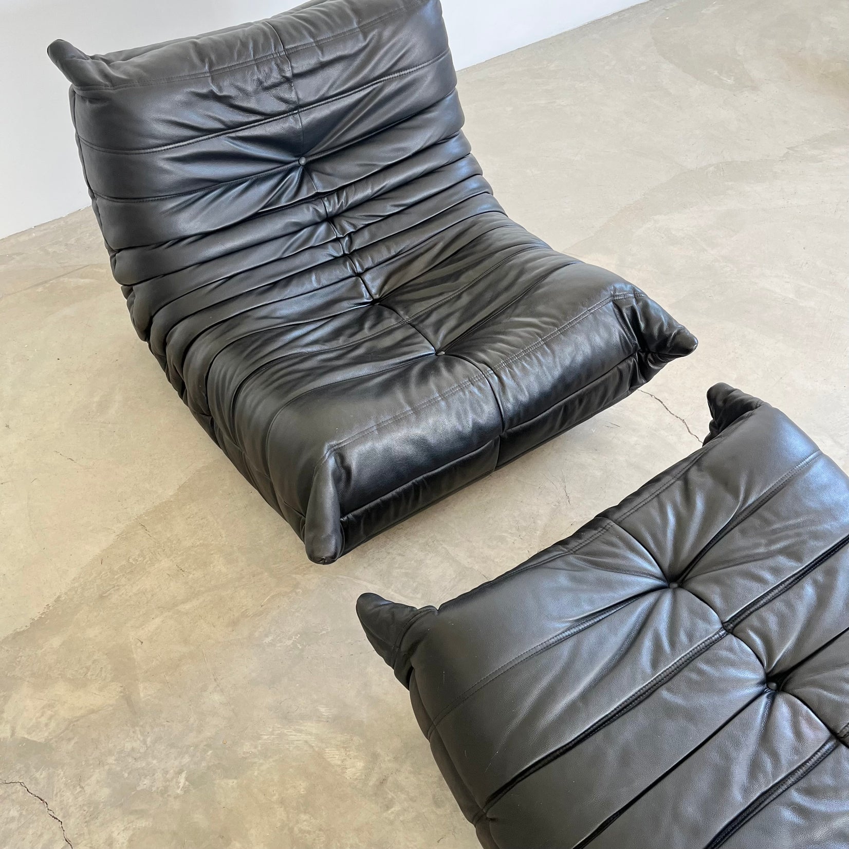 Black leather Fireside Togo Seat & Ottoman