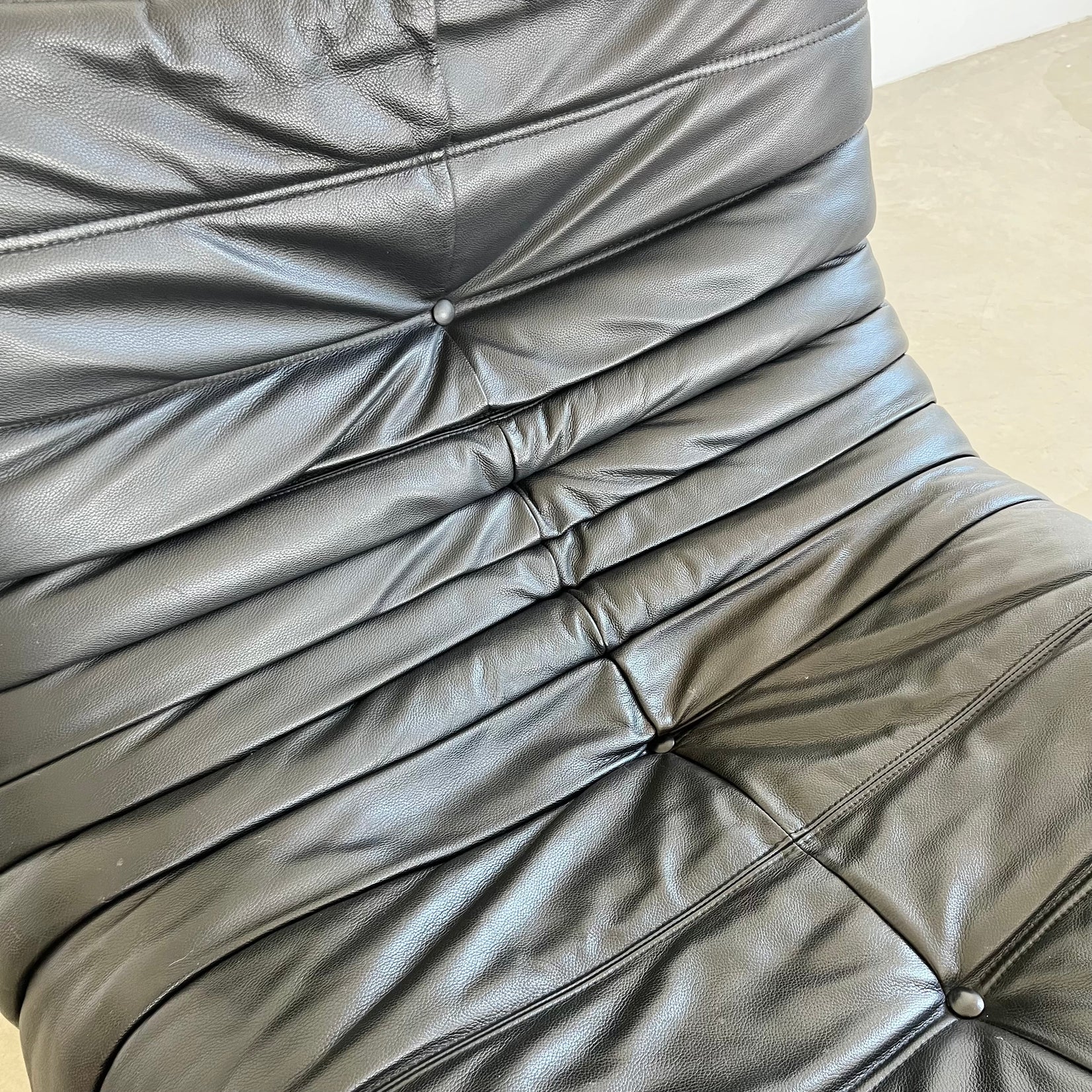 Black leather Fireside Togo Seat & Ottoman