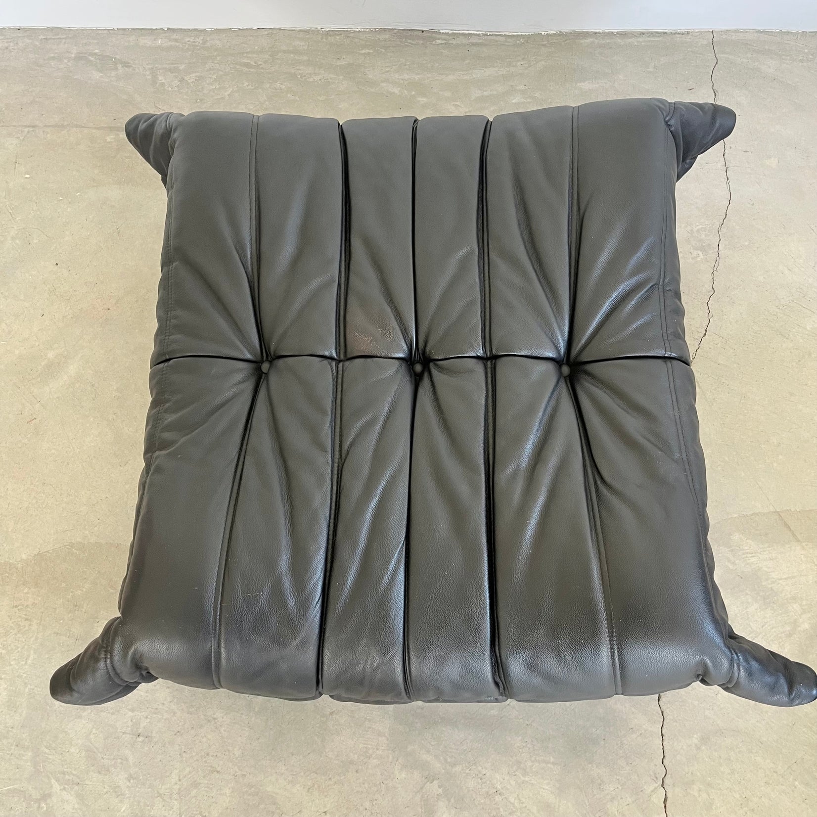 Black leather Togo Ottoman