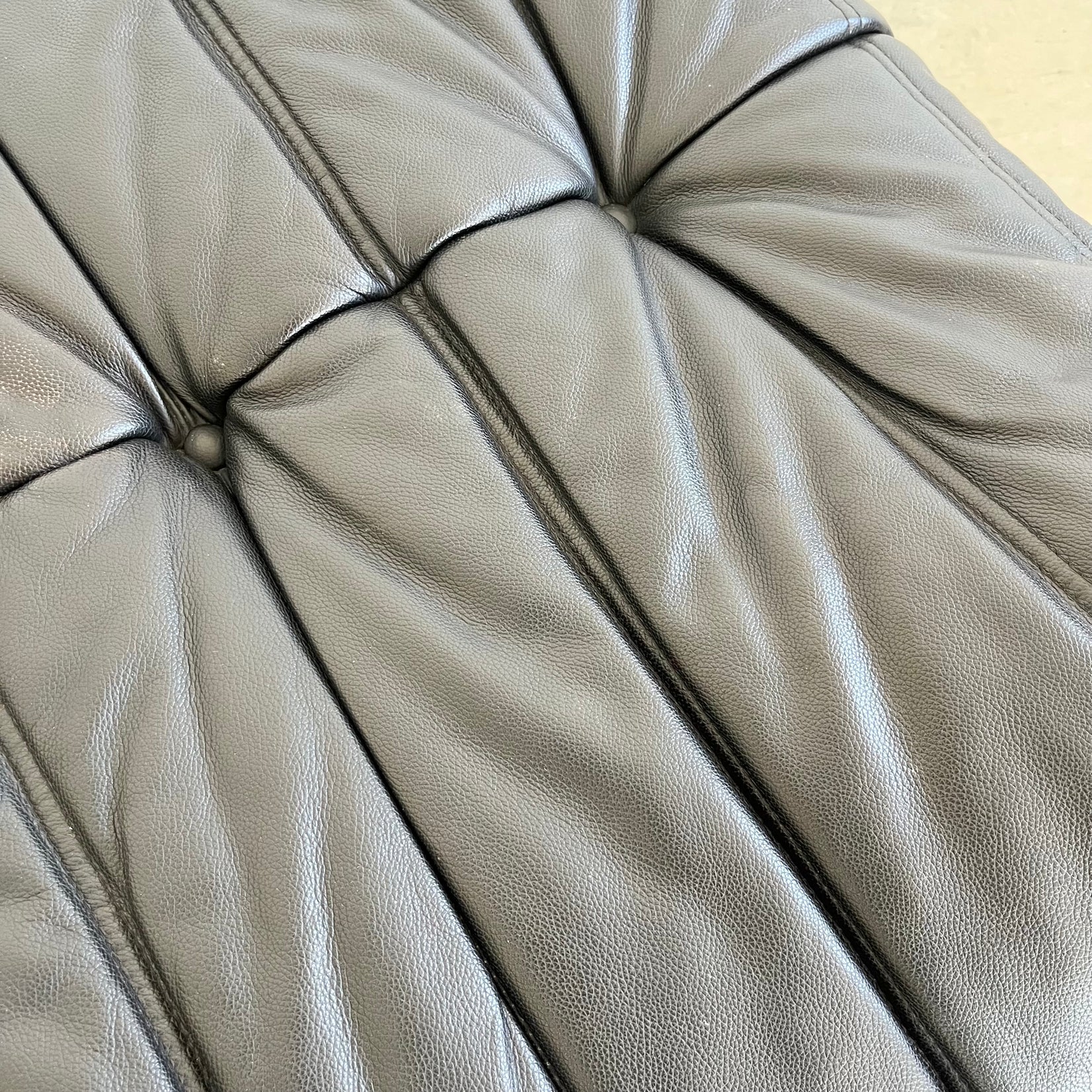 Black leather Togo Ottoman