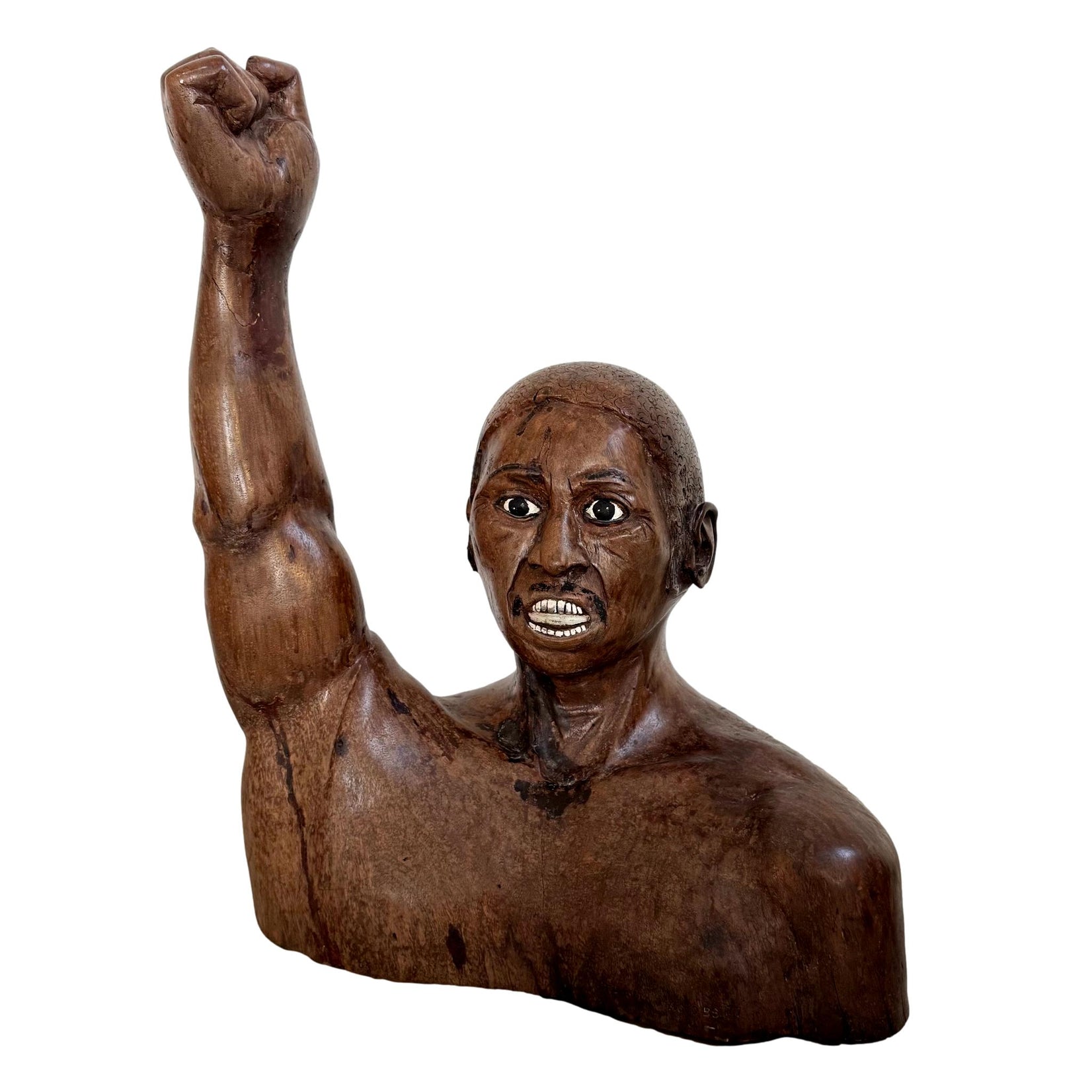 Raised Fist Wood Carving