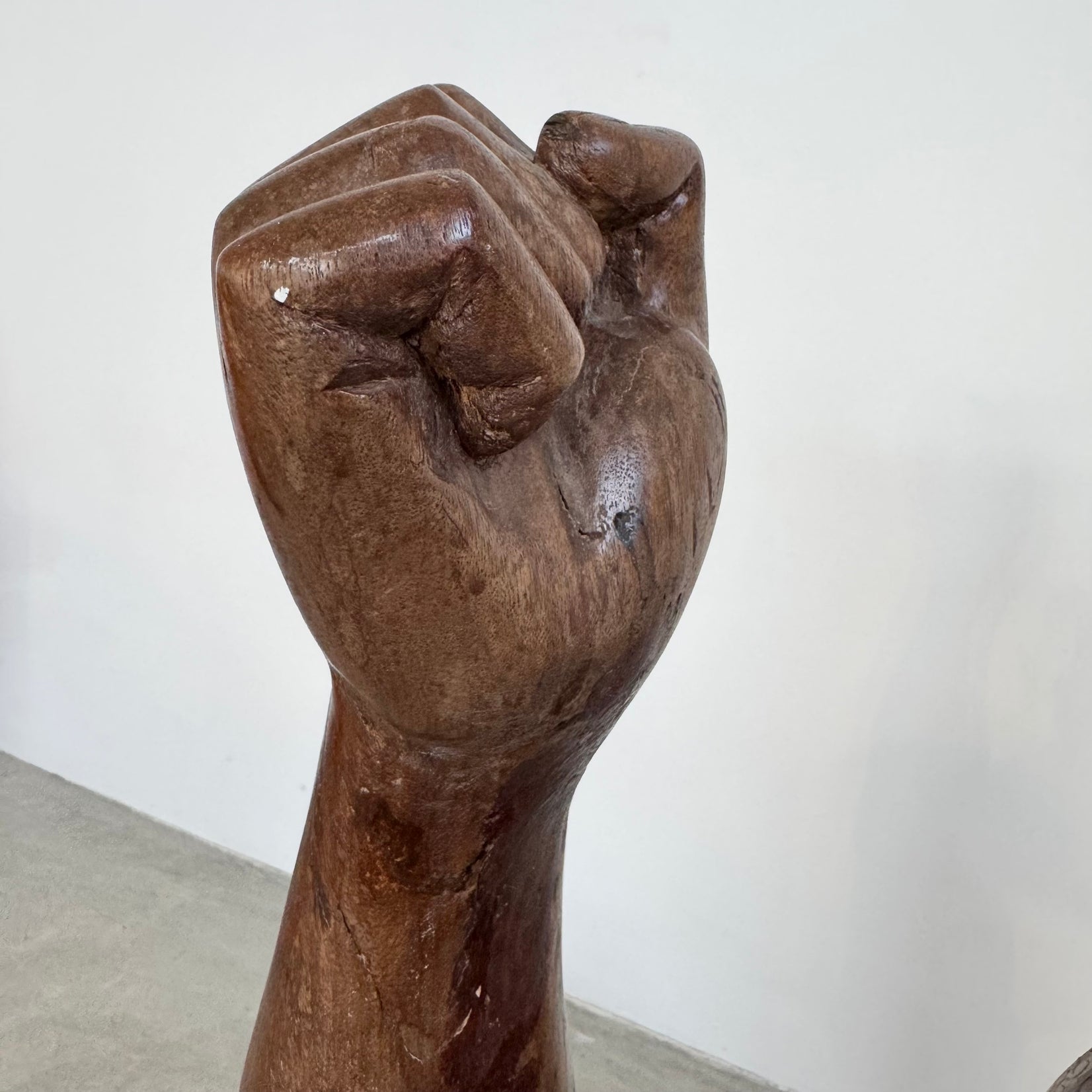 Raised Fist Wood Carving