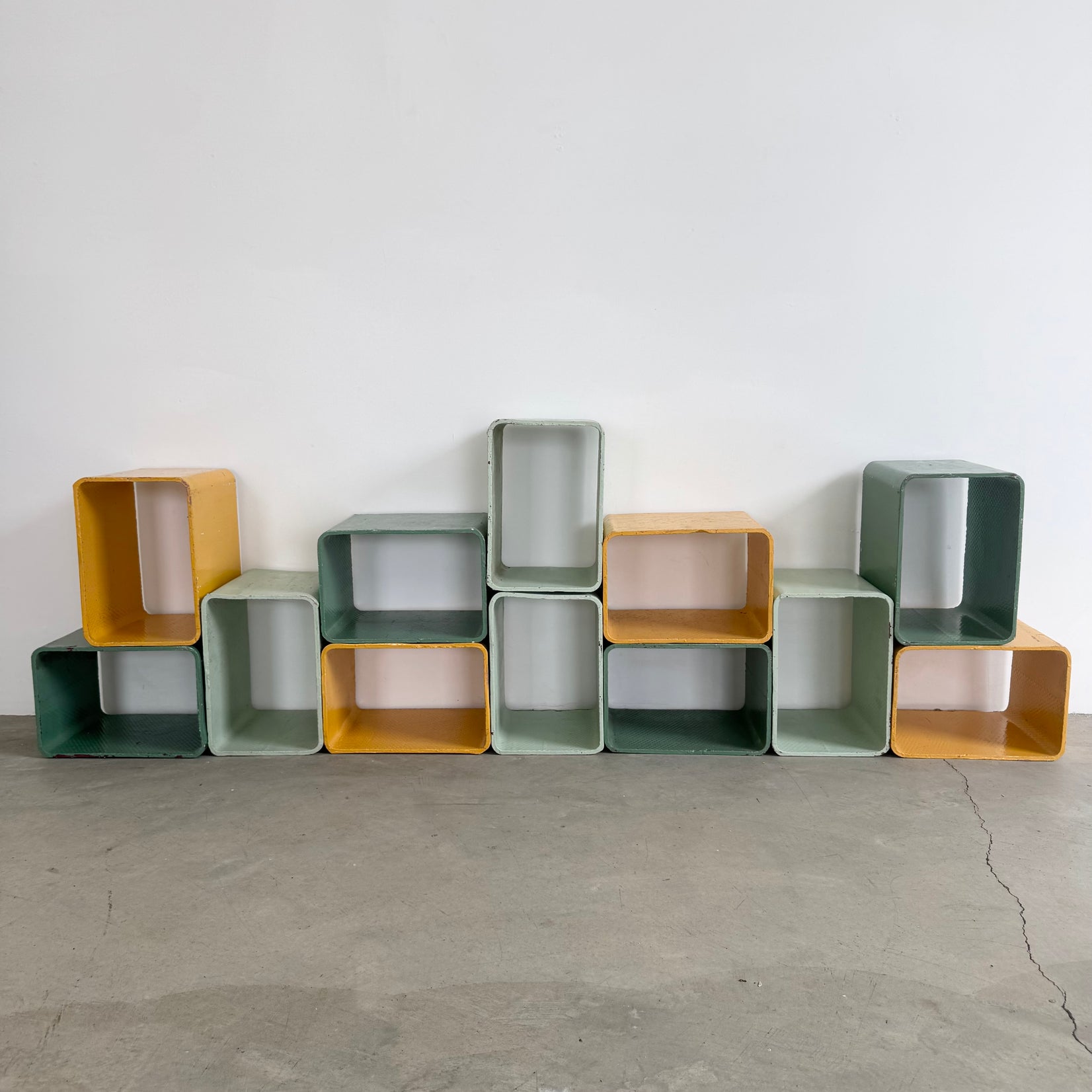 Yellow and Green Modular Concrete Bookcase