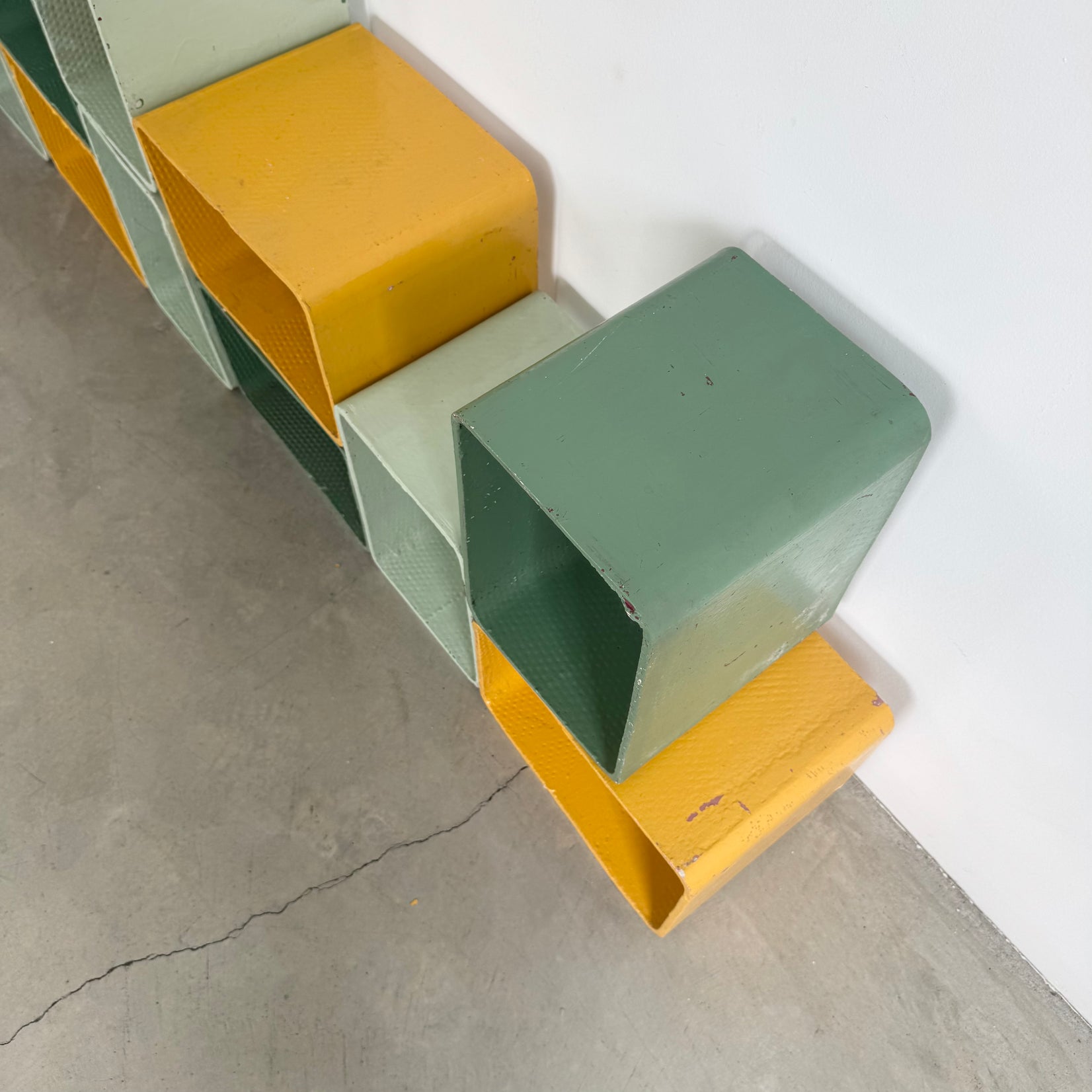 Yellow and Green Modular Concrete Bookcase