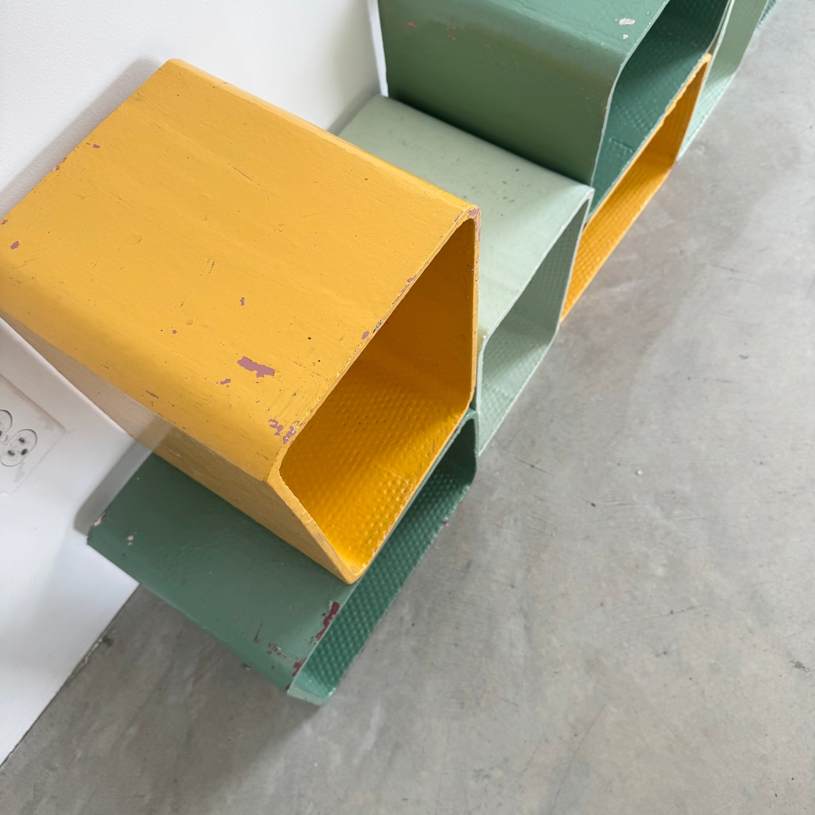 Yellow and Green Modular Concrete Bookcase