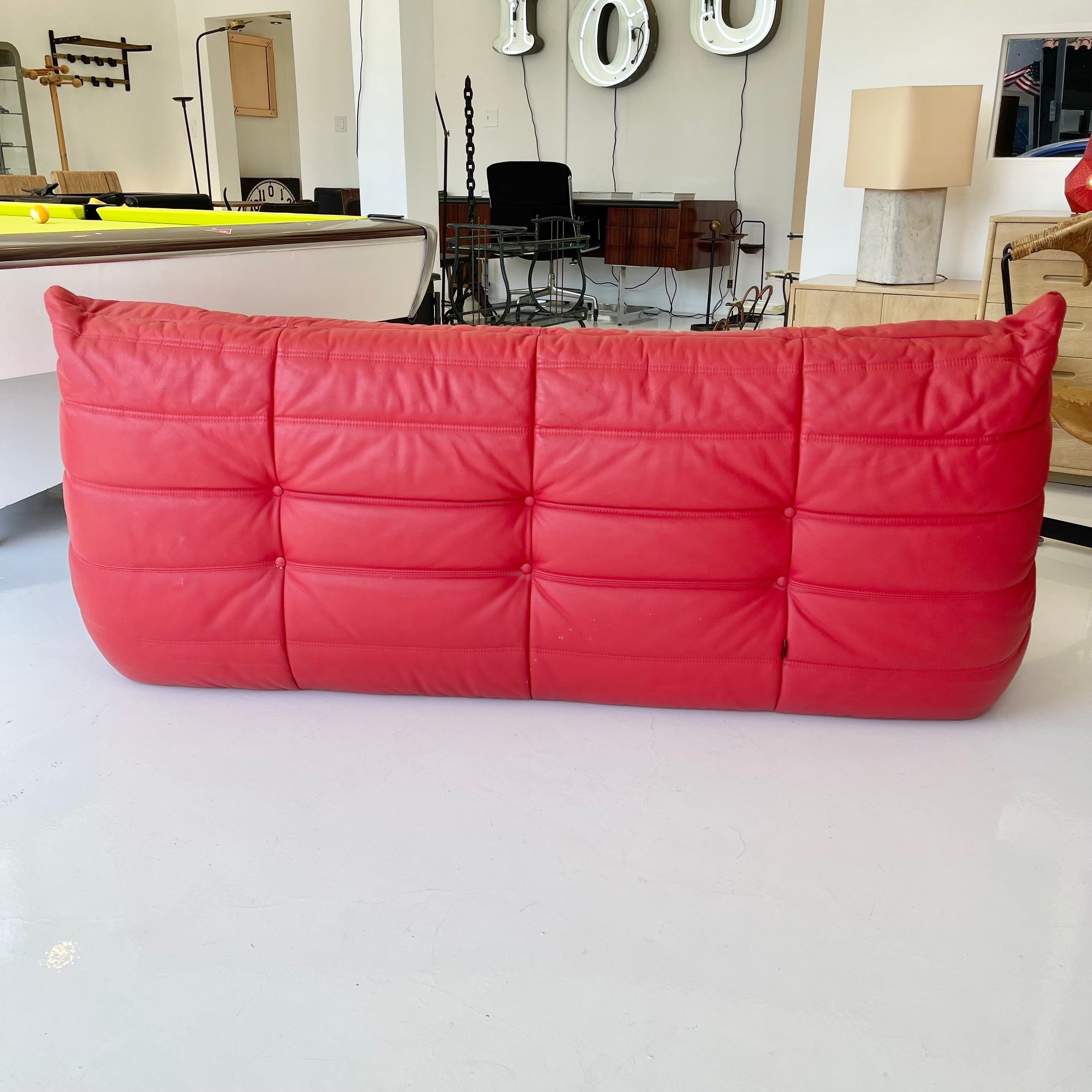 Red leather one seater 'Togo' lounge chair by Michel Ducaroy for